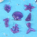 Ensemble de charms ocean en resine coloree etoile de mer coquillage pour deco telephone et art - Violet