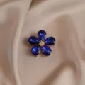 Blue crystal flower brooch detail, elegant five-petal rhinestone pin for women coat. - Blue
