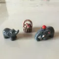 Set of 3 miniature resin figurines featuring two gray elephants and a tiny bread basket - Elephant Set