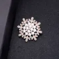 Elegant snowflake-shaped pearl and crystal brooch pin with a gold-tone metal finish - Hoop Pearl Style