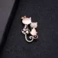 Exquisite rose gold cat brooch featuring pink cat's eye stones and sparkling rhinestones - Cat and Kitten Style