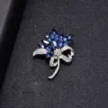 Elegant silver-tone flower brooch with navy blue crystals and sparkling rhinestones - Blue Enchantress Style