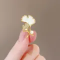 Elegant golden ginkgo leaf brooch featuring white shell inlay and delicate pearl accents - Ginkgo Leaf Style (107#)