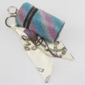 Detailed view of gradient rhinestone keychain with a stylish chain pattern silk scarf. - Blue Stripe