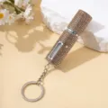 Primo piano dell'atomizzatore di profumo da 5 ml con strass color champagne - Oro champagne
