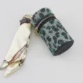 Close-up of leopard rhinestone lipstick case keychain with silk scarf detail - Green Leopard
