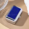 Macro detail of portable metal storage box with blue rhinestone inlay on the lid - Sapphire Blue