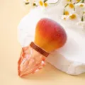 Close-up of a luxury orange nail dust brush featuring a sparkling diamond-shaped handle - Diamond Style / Orange