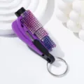 Close-up detail showing the sparkling rhinestones on a purple 2-in-1 car safety window breaker. - Purple Gradient (C10)