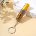 Détail d'un atomiseur de parfum de 5 ml orné de strass dorés en porte-clés élégant - 5ml / Or champagne