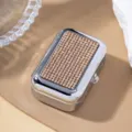 Close-up of a silver cigarette case with sparkling rhinestone-encrusted top lid - Khaki