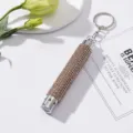 Close-up of champagne rhinestone-studded mini LED flashlight keychain with heart detail - Without Battery / Khaki