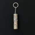 Close-up view of a sparkling rhinestone-encrusted 5ml portable perfume atomizer keychain - Colorful