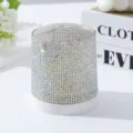 Close-up macro detail of a 48-hole nail drill bit storage box with iridescent rhinestones - AB White
