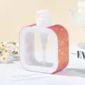 Macro detail of a square white pump dispenser bottle with sparkling pink rhinestones - 300ml / AB Red