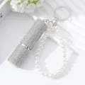 Detailed view of a silver 5ml rhinestone perfume atomizer with pearl bead keychain strap - White