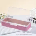 Macro view of a luxury pink rhinestone-encrusted nail art storage box with a clear lid. - Full Diamond Style / Pink