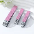 Set mit drei Edelstahl-Nagelknipsern mit eleganten rosa Strassstein-Dekorationsdetails - Dreiteiliges Set / AB Rosa