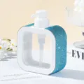 Detailed view of the elegant blue rhinestone-studded pump bottle dispenser for travel use - 300ml / Lake Blue