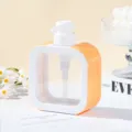 Detail view of white refillable pump bottle with vibrant orange rhinestone embellishments - 300ml / Iridescent Orange