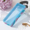 Detailed view of iridescent rhinestone-encrusted nail art storage box with a blue lid - Full Diamond Style / Royal Blue