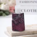 Detailed macro view of luxury purple rhinestone studded travel perfume spray bottle - 30ml / Purple Pink Gradient