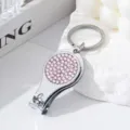 Silver nail clipper keychain with pink rhinestone detail and bottle opener function - Light Pink