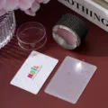Close-up detail of rhinestone-decorated nail stamper kit with scraper and floral plate - Black