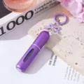 Λεπτομέρεια μοβ ατομιζέρ αρώματος 5ml με φιόγκο και κρίκο μπρελόκ - Μωβ