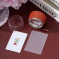 Nail art stamper set with rhinestone handle, clear silicone head, and lace plate - Orange Red