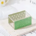 Close-up detail view of an 18-hole green rhinestone acrylic nail drill bit storage organizer. - Green