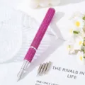 Close-up of pink rhinestone nail art fountain pen with five replaceable metal tips - Rose Red
