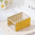 Detailed macro view of 18-hole acrylic nail drill bit organizer featuring yellow rhinestones - Yellow
