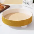 Detail of a luxury round tray with golden rhinestones and wood grain texture base. - Yellow