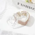 Close-up of heart-shaped glass dappen dish with rose gold rhinestones for nail art. - Heart-Shaped With Lid Champagne Gold Rhinestone Style / Champagne Gold