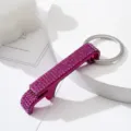 Close-up of a sparkling fuchsia rhinestone-encrusted aluminum bottle opener keychain. - Rose Red