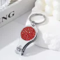Silver multifunctional nail clipper keychain with red rhinestones and bottle opener - Red