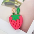 Detailed view of a cute strawberry-shaped PU leather coin purse and earphone case - Strawberry Style