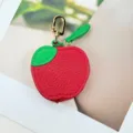 Mini apple-shaped PU leather coin purse and headphone case with a golden carabiner. - Apple Style