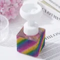 Macro view of a square foaming bottle decorated with rainbow rhinestones - Colorful