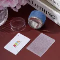 Complete rhinestone nail art stamper set featuring a blue gem stamper and pattern plate. - Blue