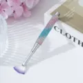 Close-up of rhinestone nail art fan brush with gradient sparkle handle design. - Blue Multicolor