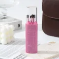 Detail of pink rhinestone makeup brush set with five soft-bristle brushes in case - Pink