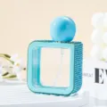 Detailed macro view of turquoise rhinestone square perfume spray bottle on a white tray - 40ml / Lake Blue