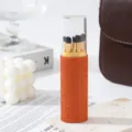 Detail view of 5pcs makeup brush set stored in a luxury orange rhinestone container - Orange Red