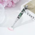 Elegant nail art fan brush with sparkling green rhinestone handle and soft pink-tipped bristles. - Green Leopard
