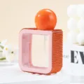 Detailed macro view of square 40ml spray bottle decorated with orange rhinestones - 40ml / Orange Red