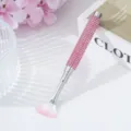 Detailed macro view of pink rhinestone handle nail art fan brush for creative design - Pink