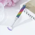 Macro view of rainbow rhinestone studded nail art fan brush with purple bristle - Colorful