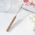 Detail of stainless steel nail art spatula with rhinestone handle on white surface - Champagne Gold
